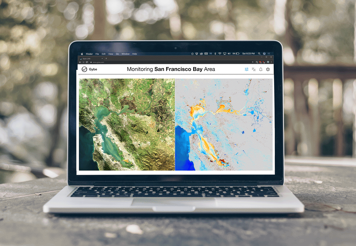 A laptop displaying satellite imagery and water-quality maps in GybeMaps